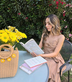 Shadow & Shine Desert Muse Maxi Dress in tan, featuring a fitted bodice with bow detail and adjustable straps. Flowy skirt.