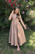 Shadow & Shine Desert Muse Maxi Dress in tan, featuring a fitted bodice with tie detail and adjustable straps, and a flowing A-line skirt.